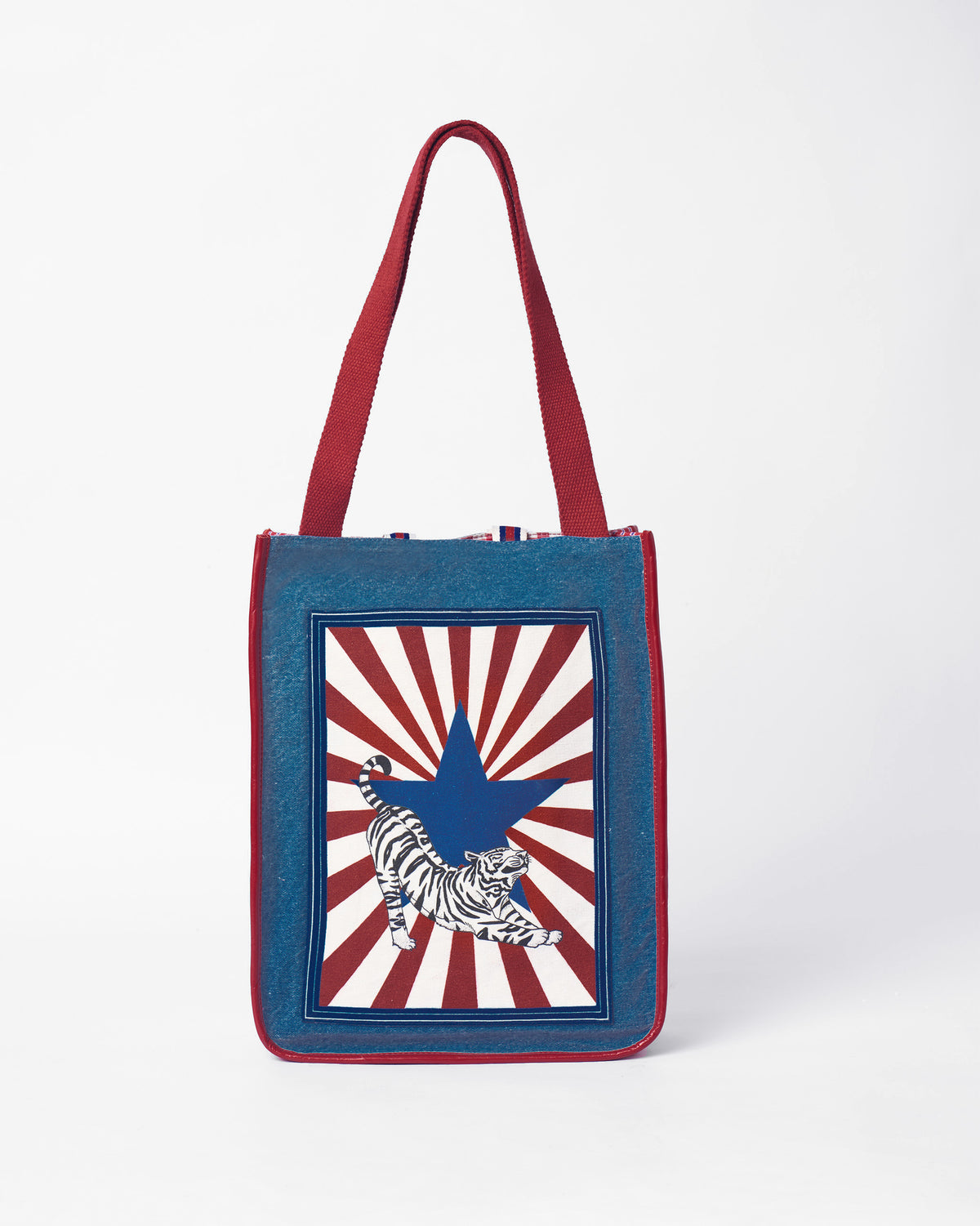 Blue Nico Matchbox tote with a tiger stamp on the front.