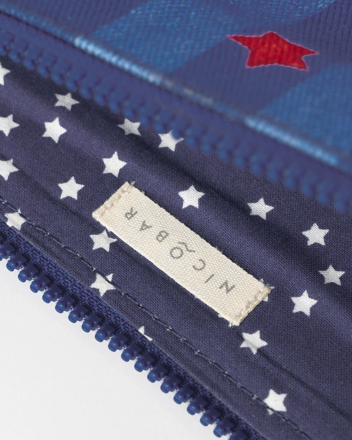 Close-up of the Nicobar label inside the Berber Laptop Sleeve.