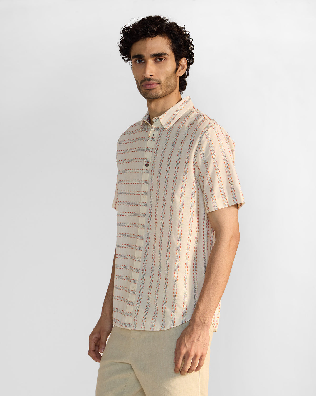 Side view of an ivory Half Sleeves Shirt showing dashed stripes that change direction across panels.