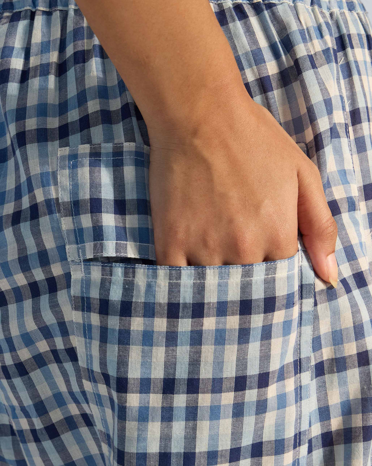 Close-up of the side pocket on blue and white checked Yoka trousers.