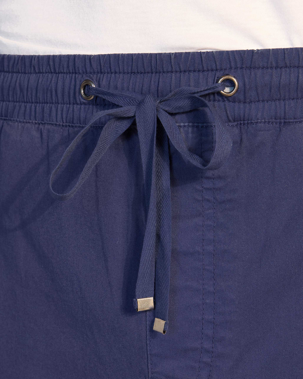 Close-up of the drawstring waistband on navy Pravah Trousers.