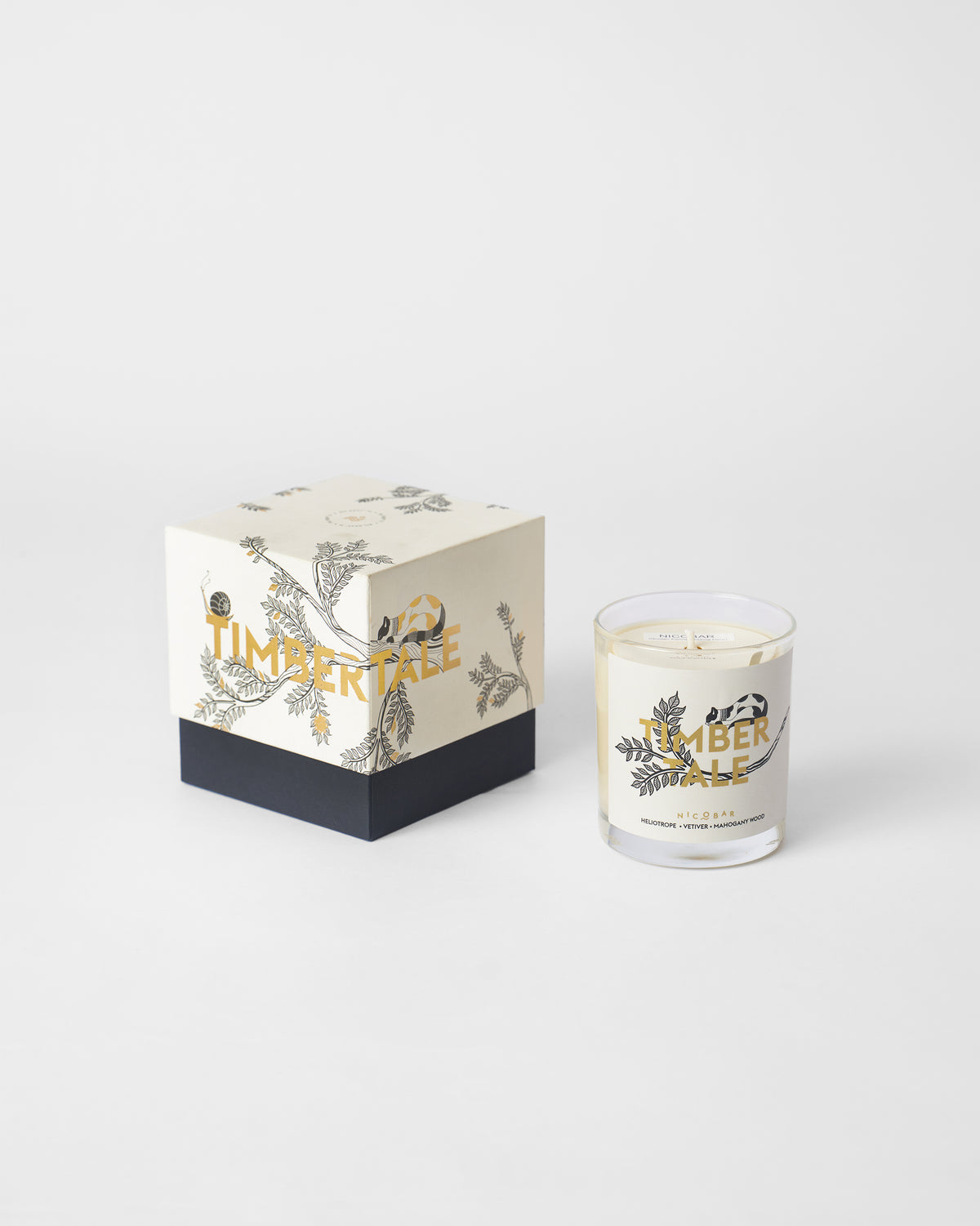 Timbertale Candle beside its cream and navy box.