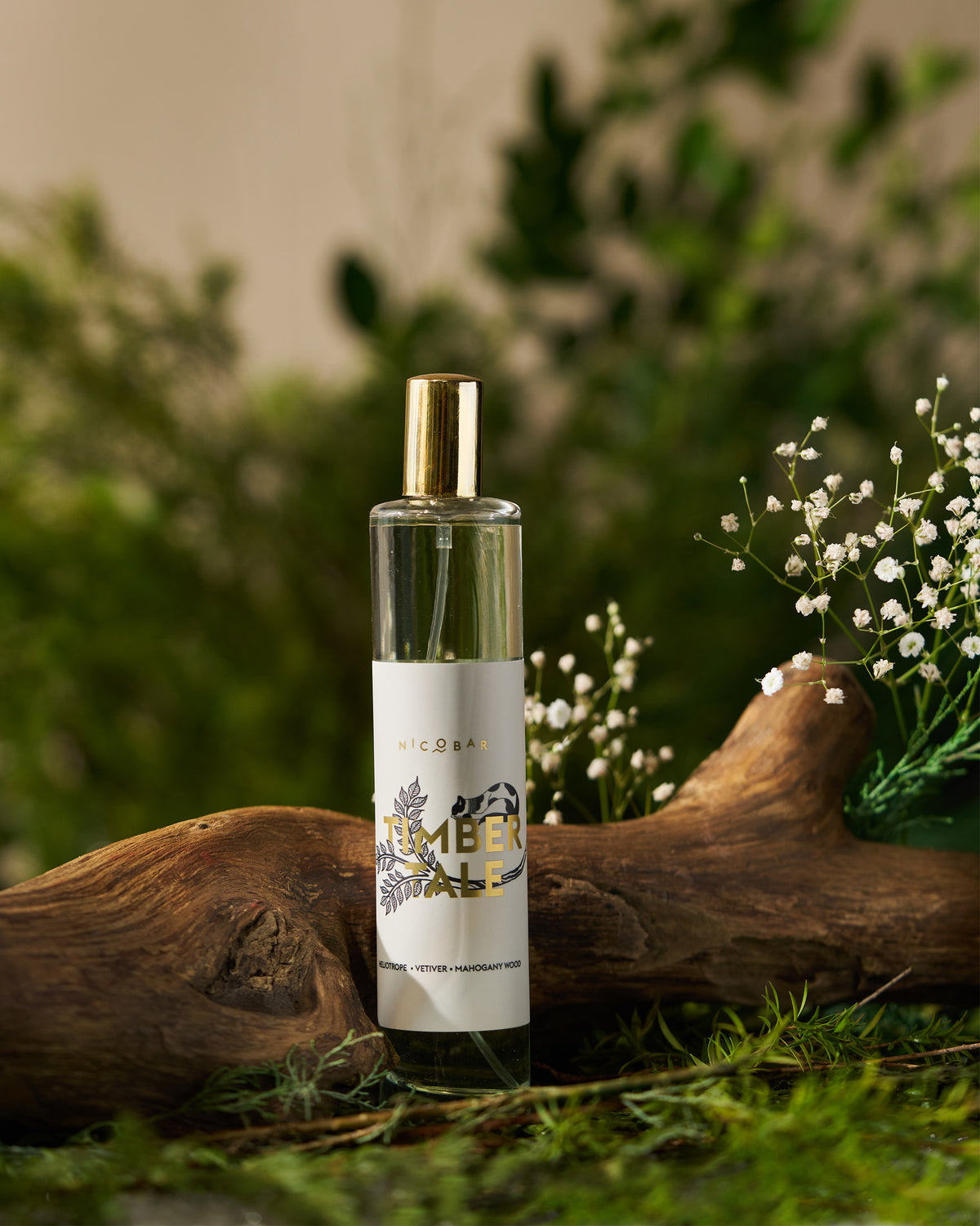 Timbertale Room Spray in a clear glass bottle with a gold spray cap.