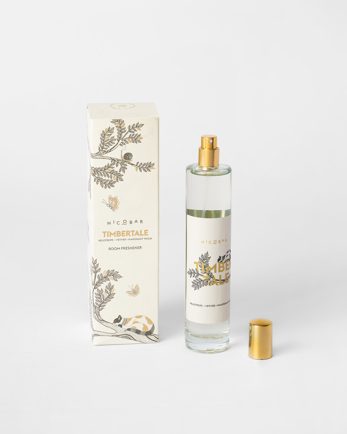 Timbertale Room Spray bottle with its gold cap removed beside its box.
