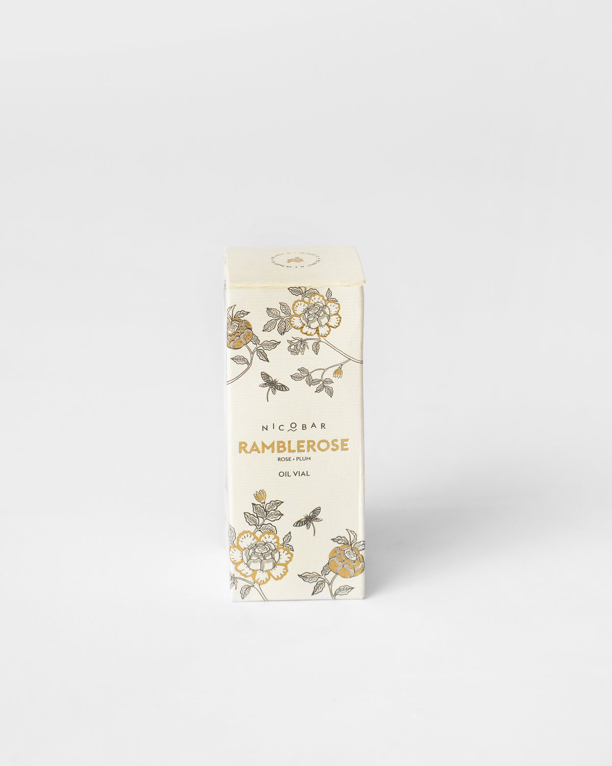 Ramblerose oil vial box with rose illustrations and gold lettering.