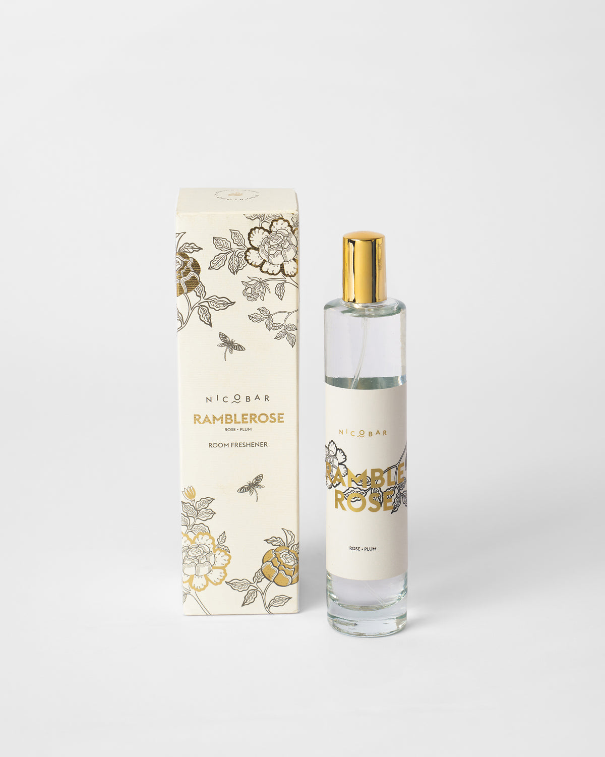 Ramblerose room spray bottle beside its printed box.