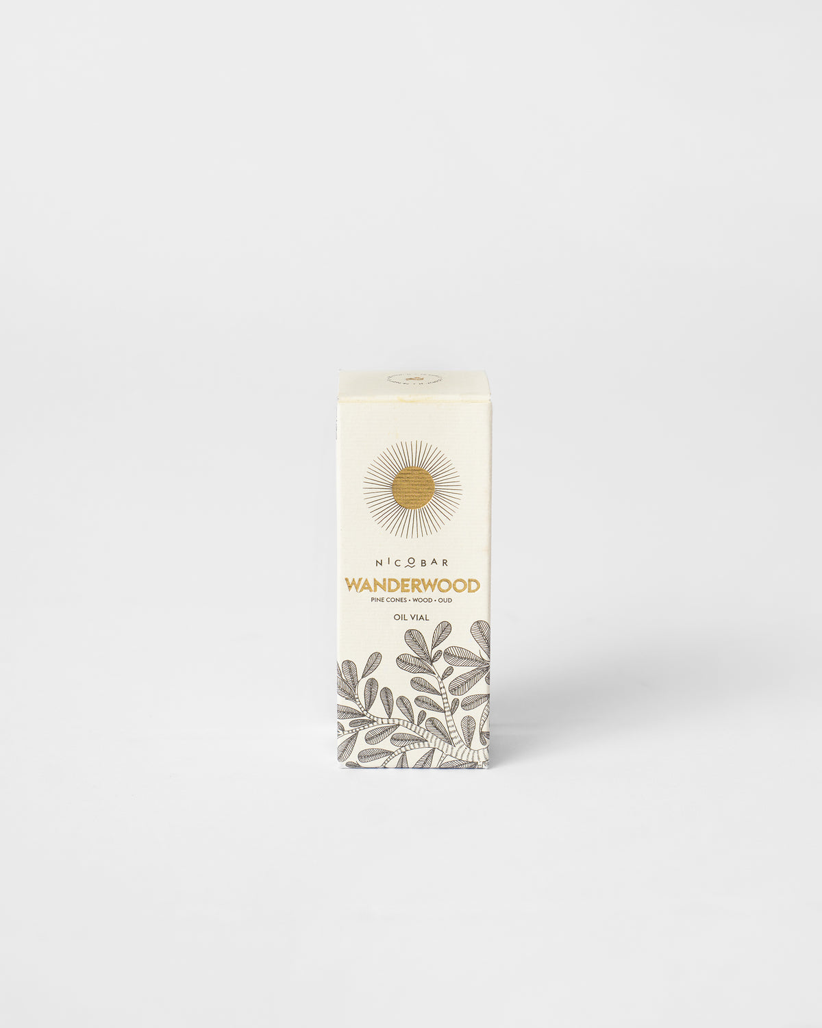 Cream Wanderwood oil vial box with leafy branch print and gold lettering.