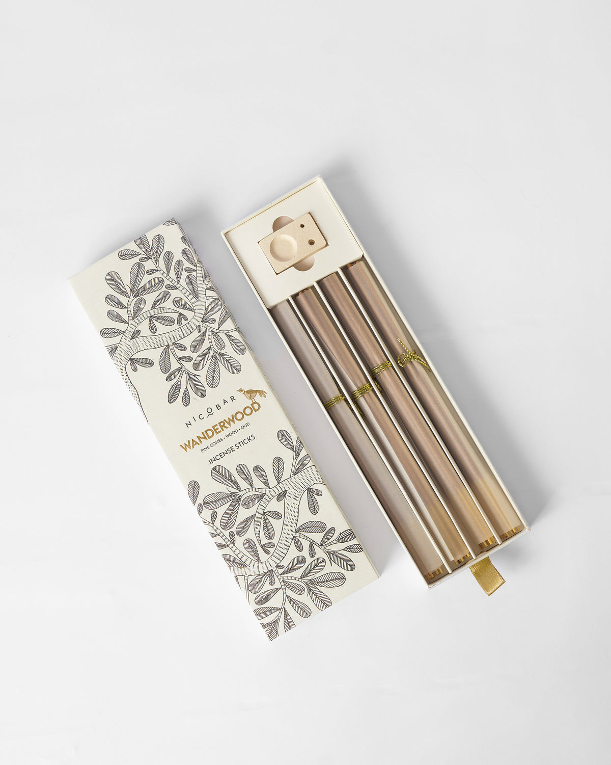 Open Wanderwood incense set with glass vials and a wooden holder.