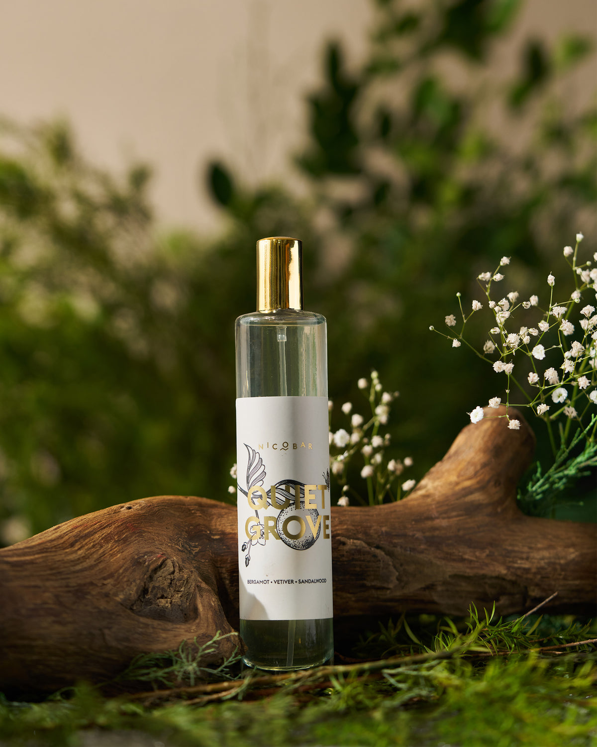Quiet Grove Room Spray bottle with a gold cap and white label.