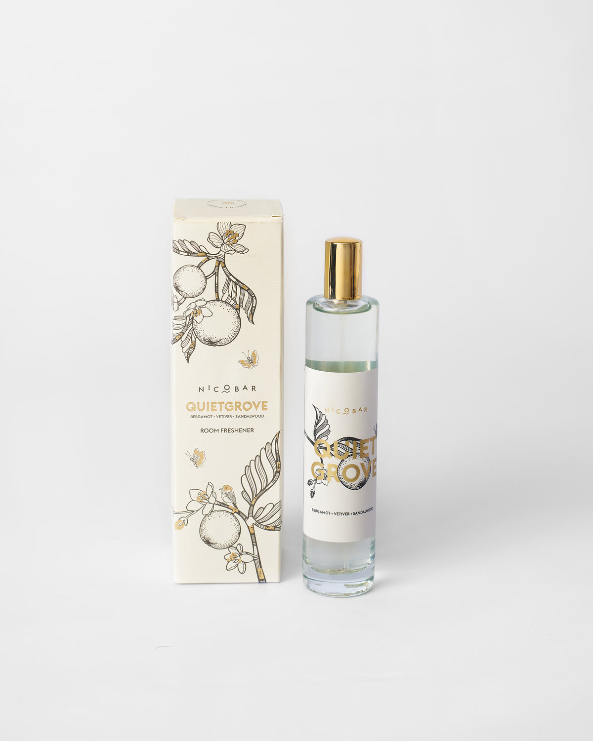Quiet Grove Room Spray bottle standing beside its cream box.
