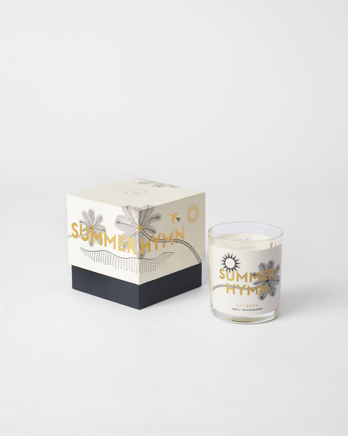 Summerhymn candle beside its cream and navy gift box.