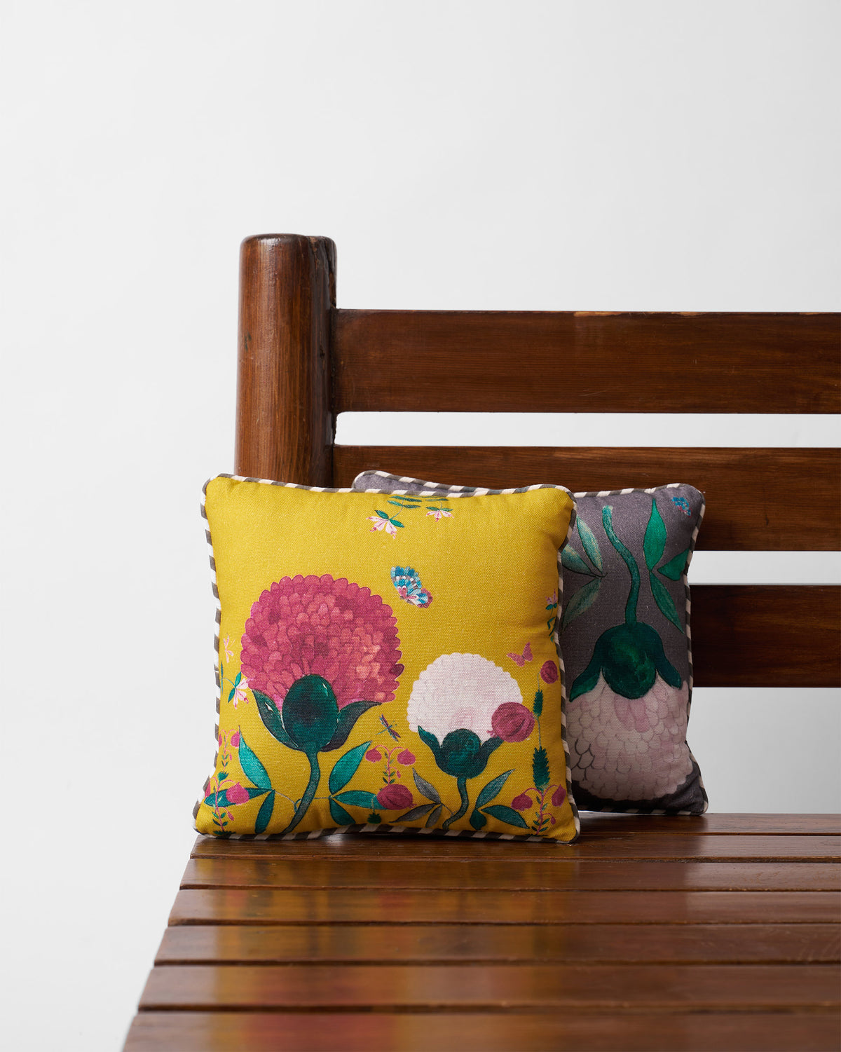 Winter Wonderland Car Cushion in yellow with pink and cream flower motifs.
