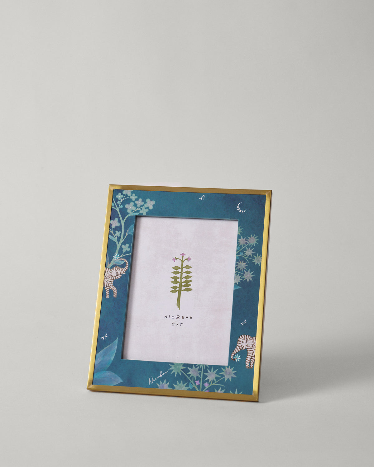 Midnight Tusk photo frame with teal elephant border and gold rim.