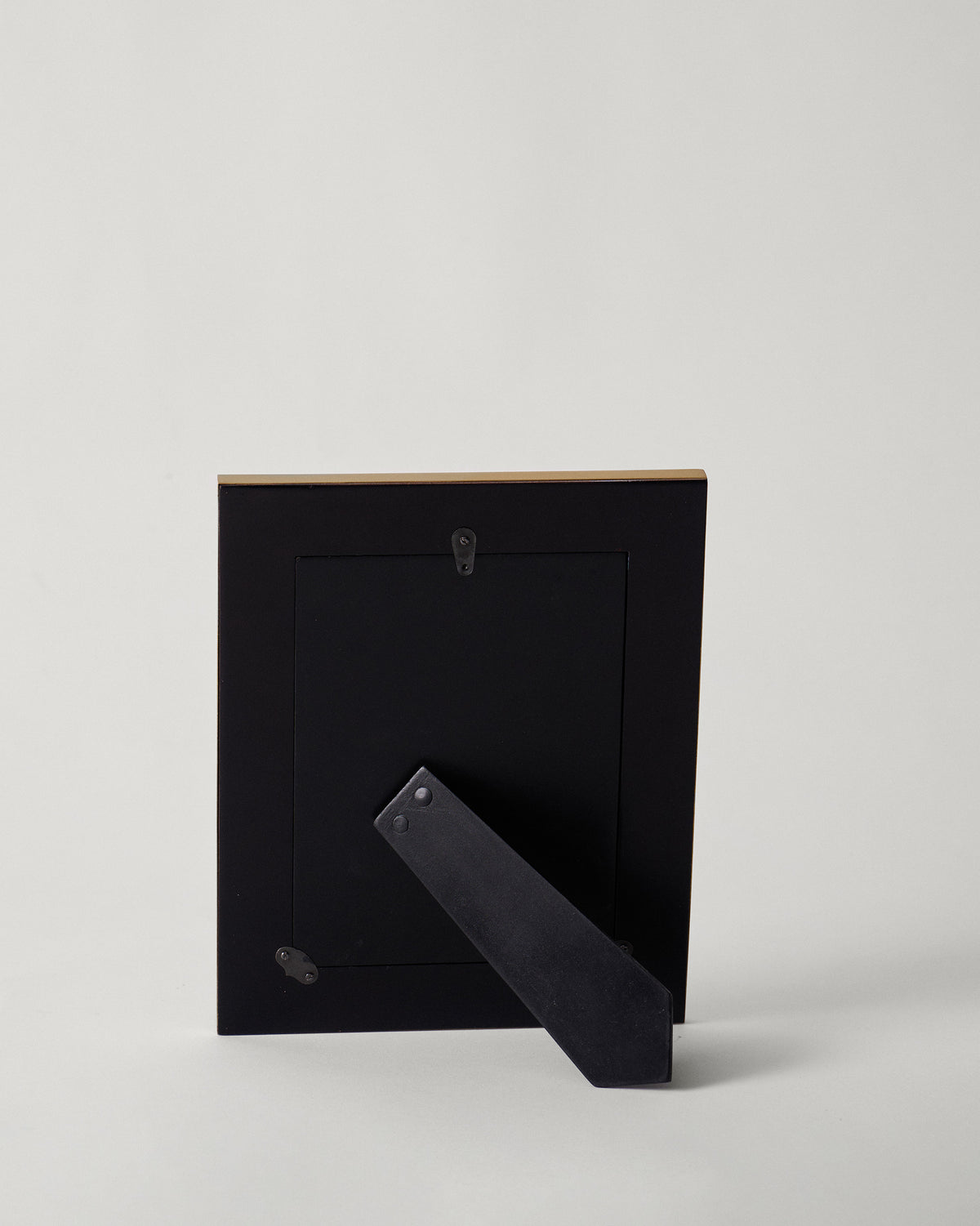 Back of a Midnight Tusk photo frame showing easel stand and hanger.