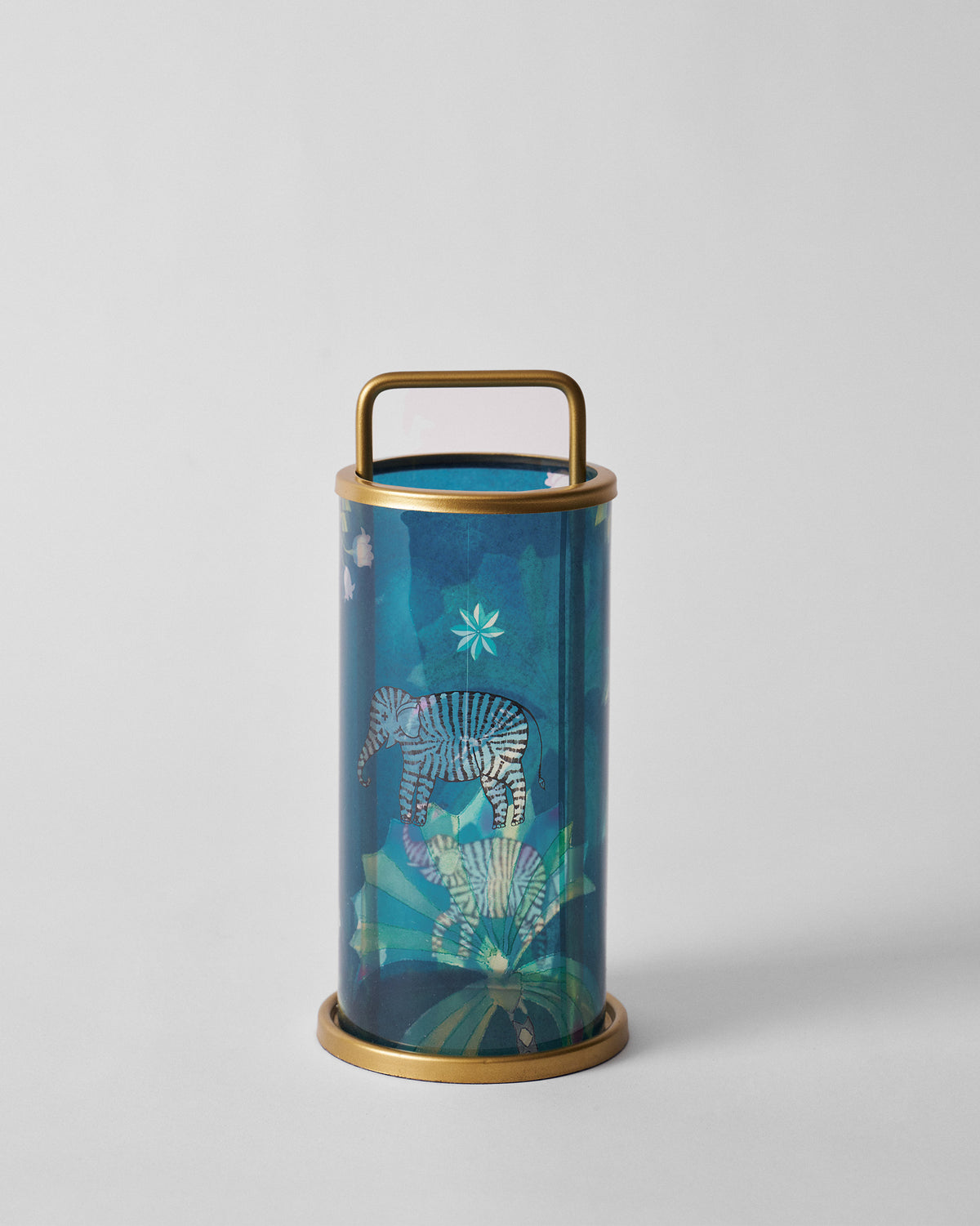 Teal Palm Bloom lantern showing a striped elephant motif and gold frame.