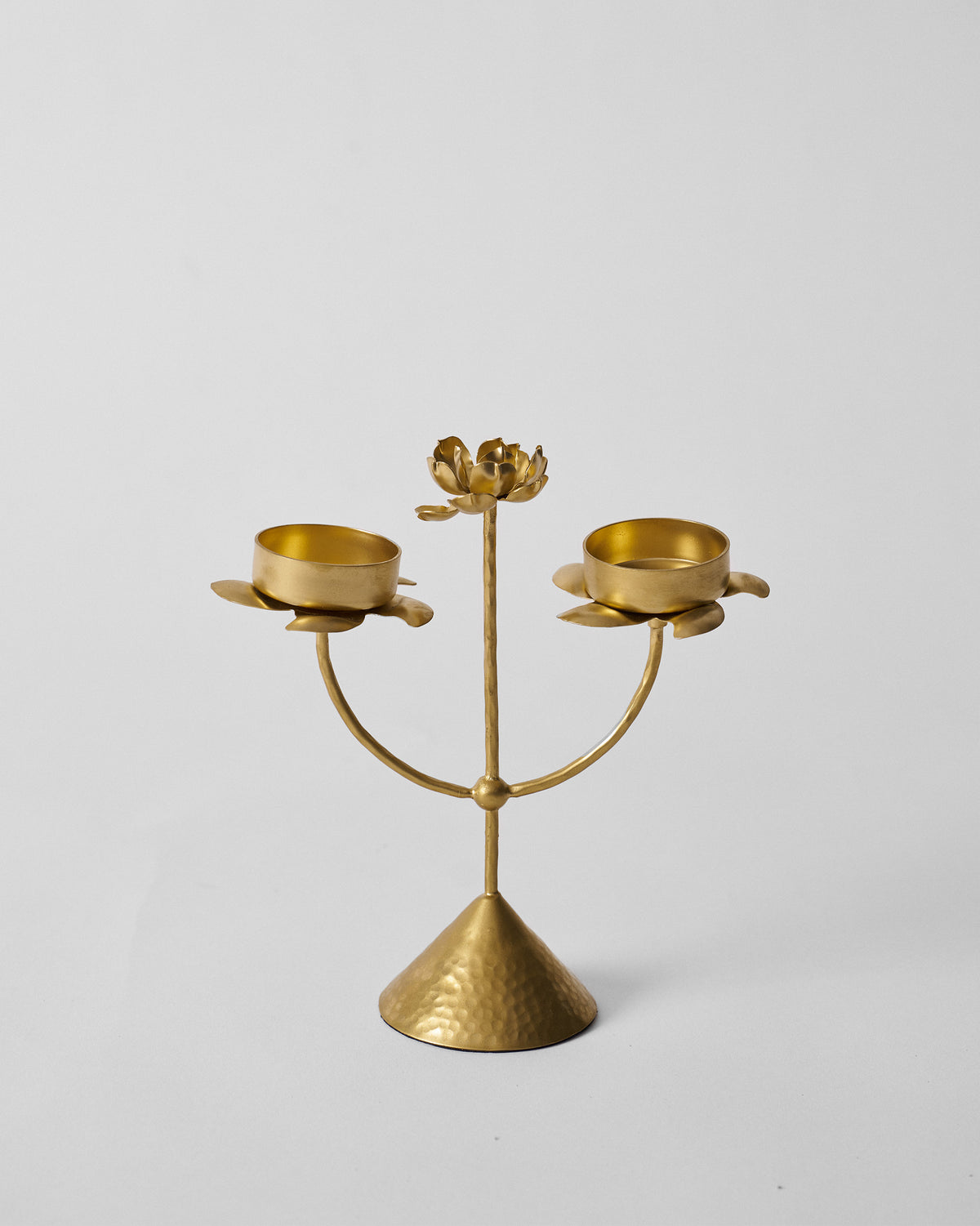 Gold Mogra bud tealight with two petal cups and a central flower.