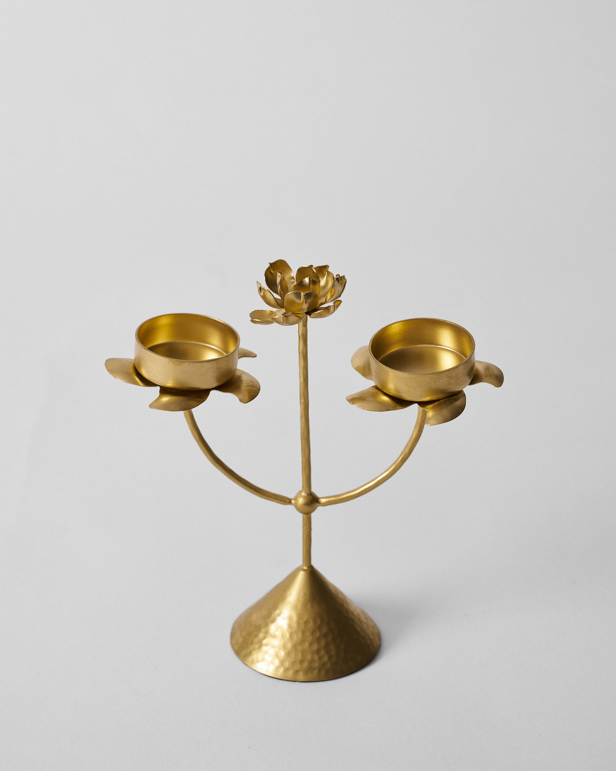 Gold Mogra bud tealight with curved arms and a hammered base.