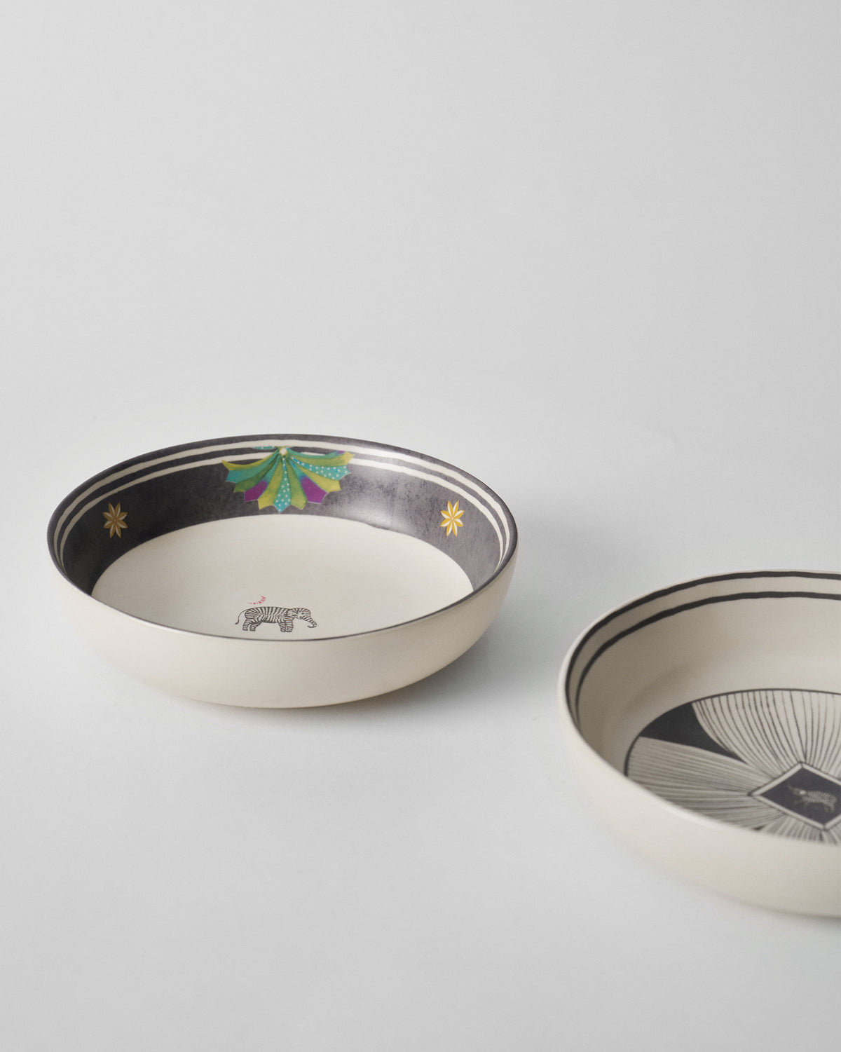 Palm Bloom bowls with zebra motif and charcoal petal centre.