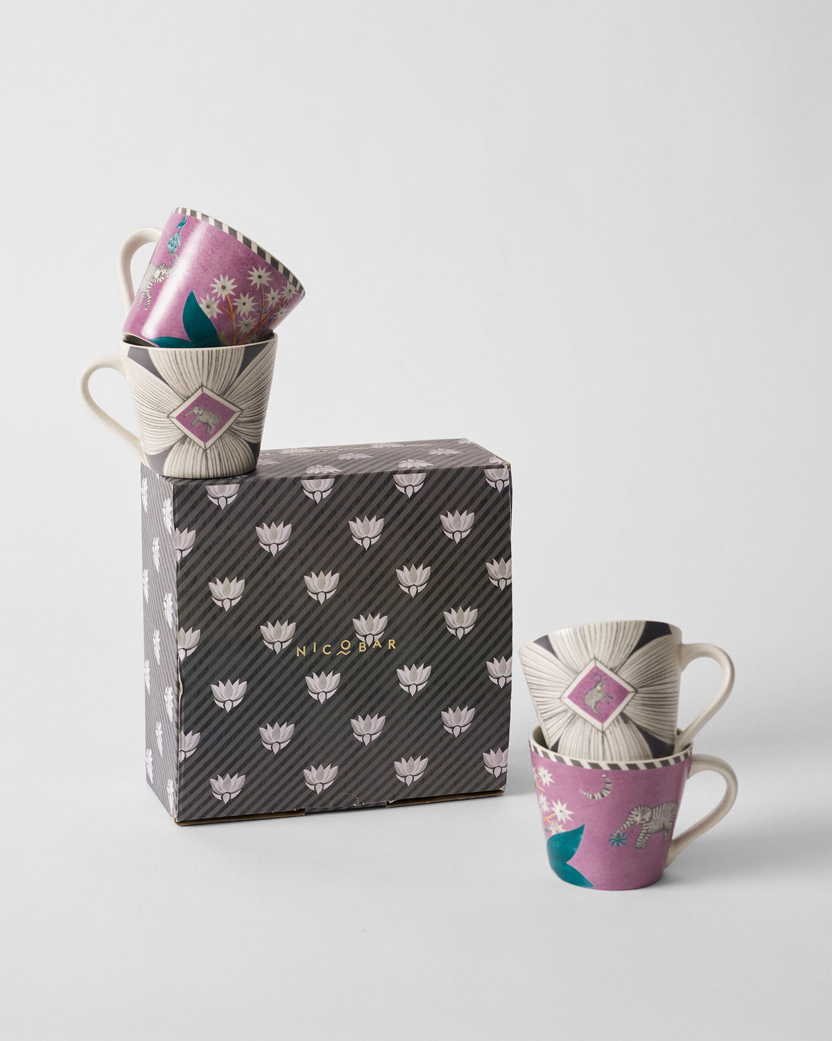 Mogra Bloom espresso mug set of four with a Nicobar striped gift box.