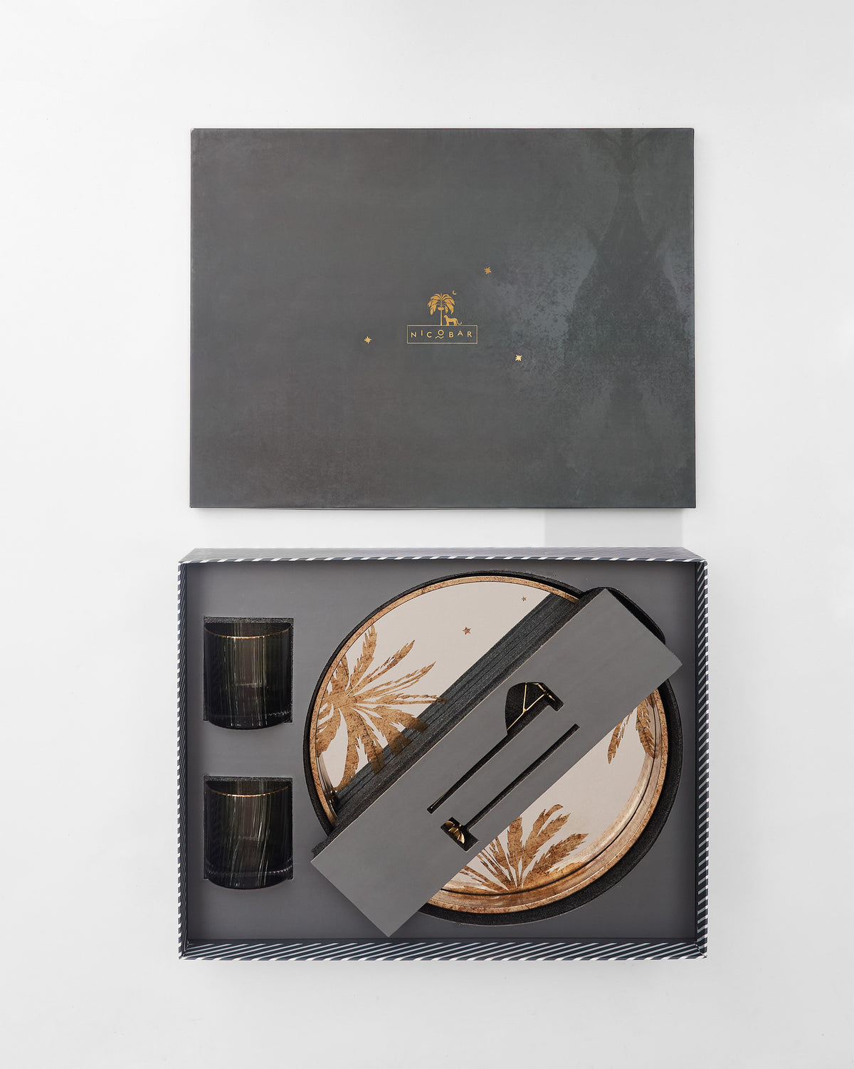 Gilded Palm gift set packed in an open box with tray, glasses and stirrers.