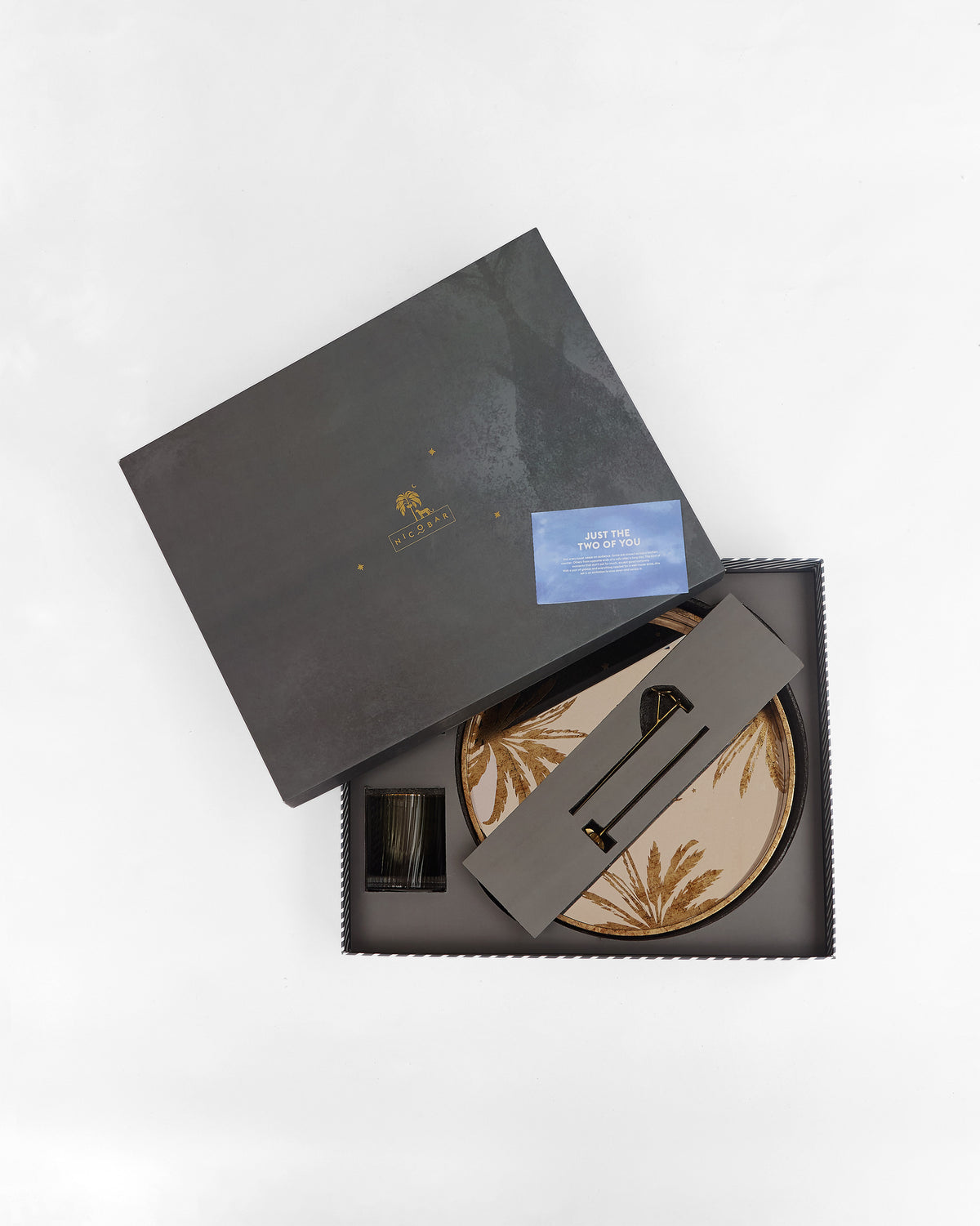 Partially open Gilded Palm gift box showing the palm tray and glassware.