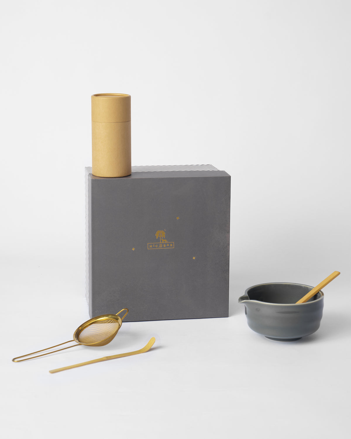 Palm Bloom Matcha Gift Set with a grey bowl, gold strainer, and Nicobar gift box.