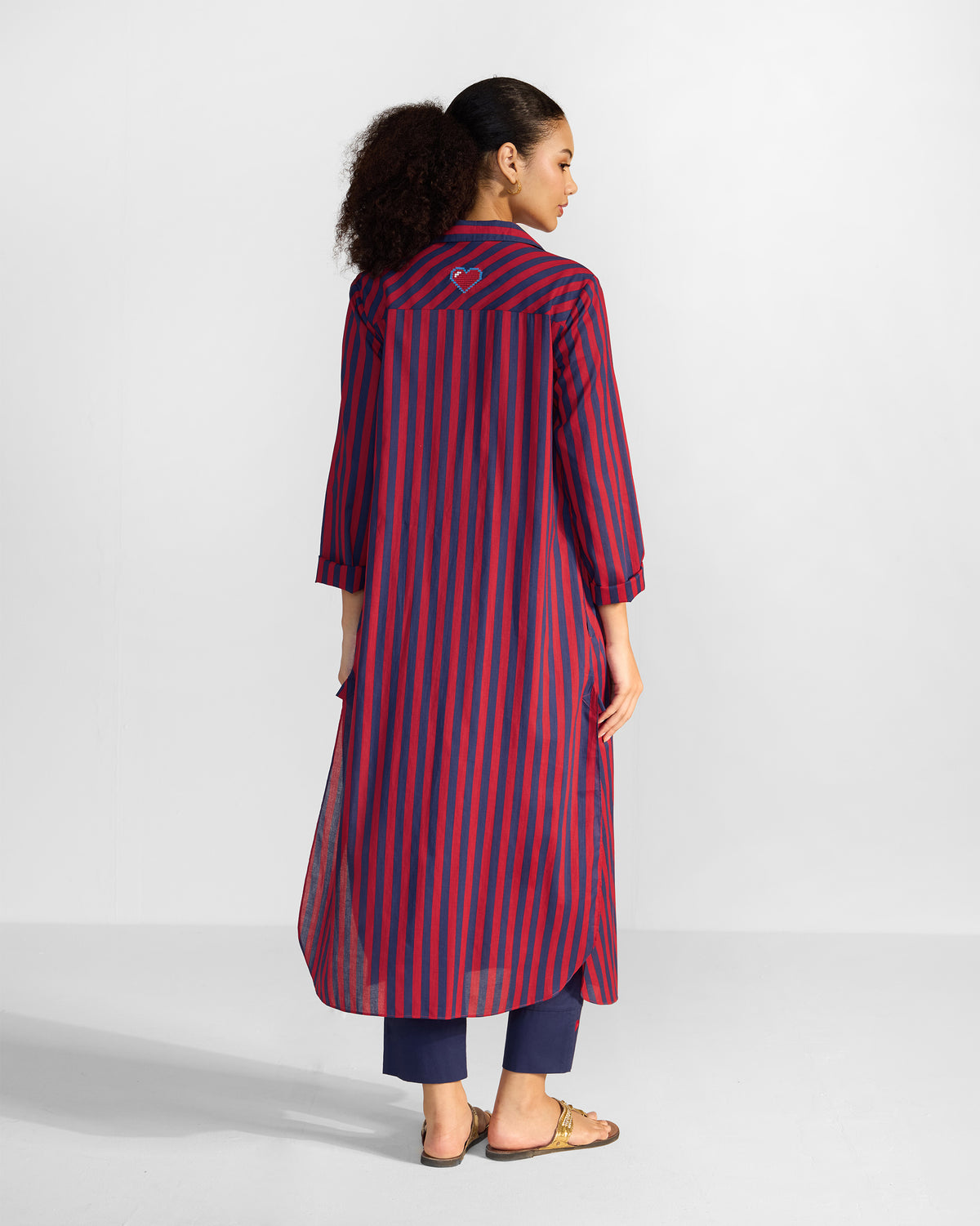 Back of a red and navy striped Nimar long shirt with a heart on the yoke.