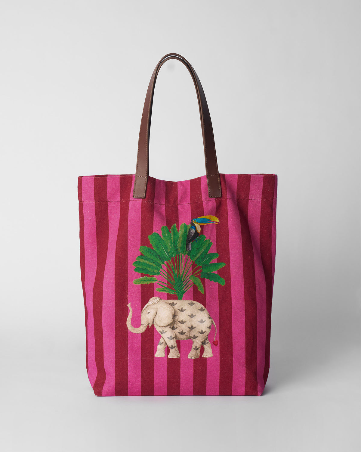 Pink and maroon Mukayu city tote with an elephant and toucan print.