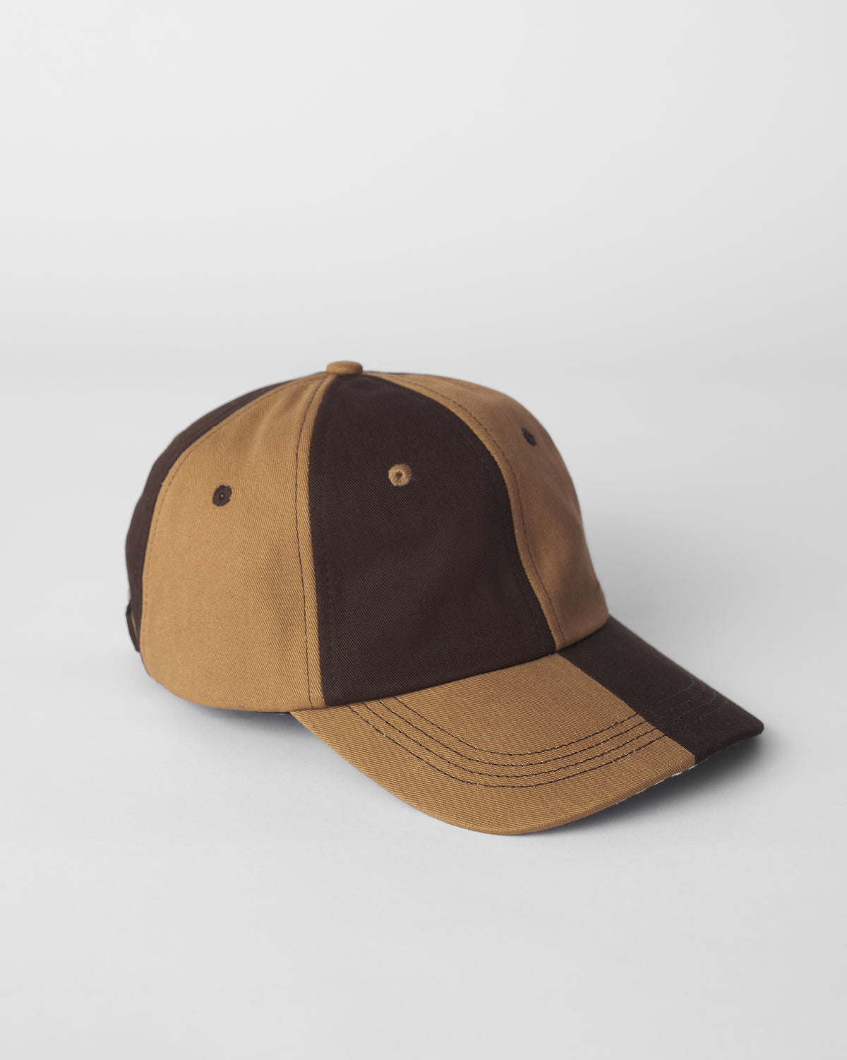 Brown and beige Aero Cap showing color-blocked panels and brim.