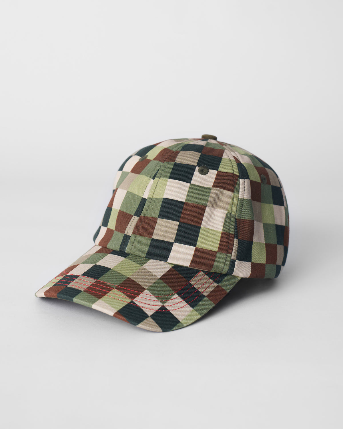 Olive pixel-print baseball cap with a curved brim and red stitching on the bill.