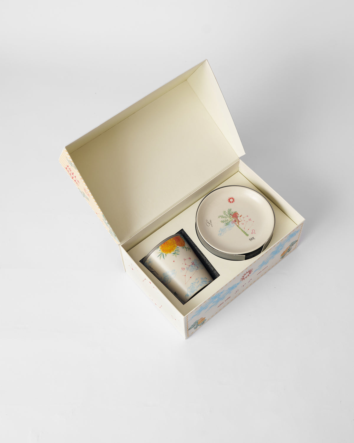 Nico Leo mug and tea plate packed in an open Nicobar gift box.
