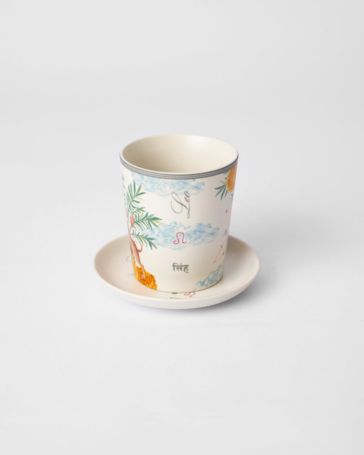 Nico Leo mug on its tea plate showing Leo and सिंह lettering.