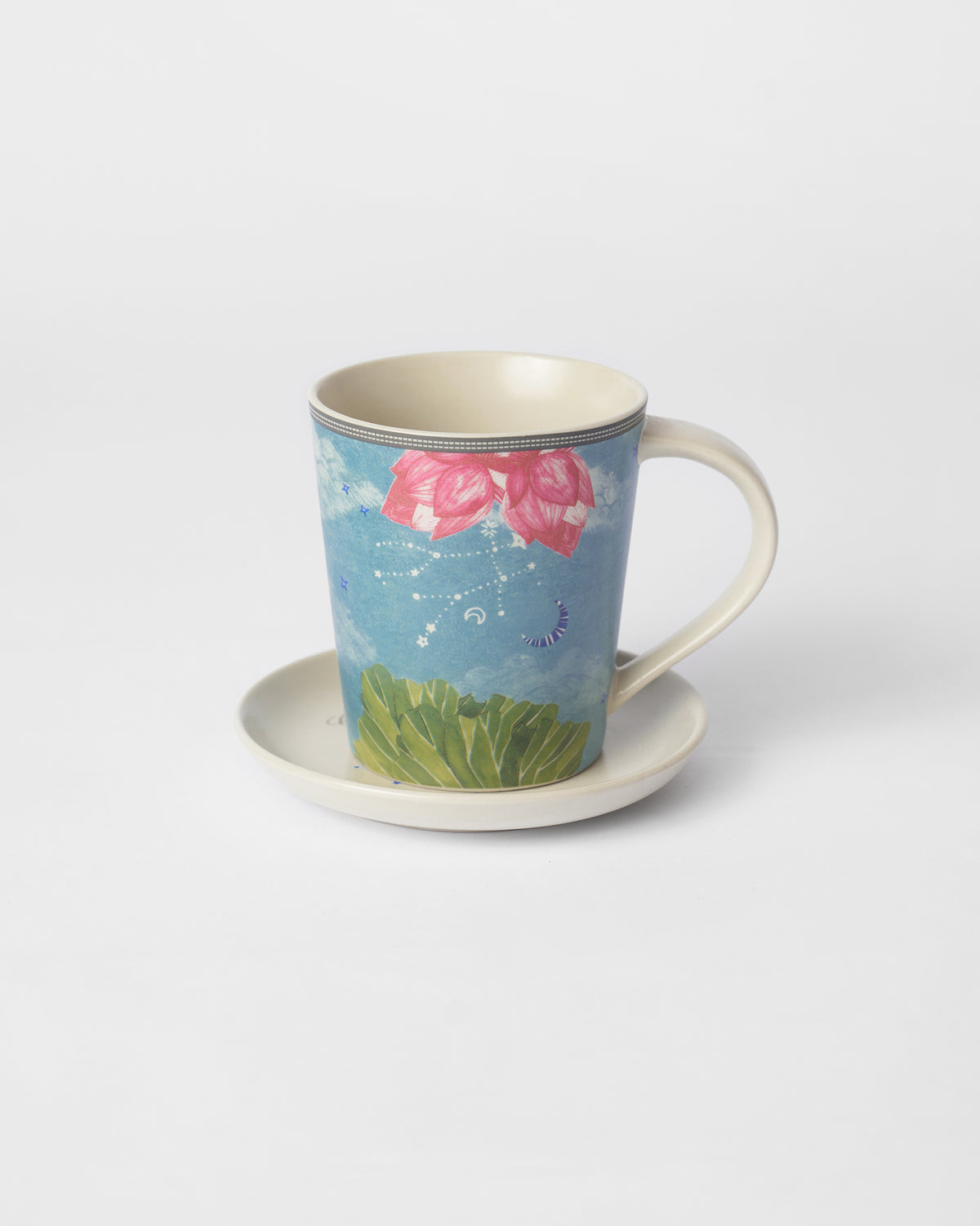 Nico Gemini mug resting on its matching cream tea plate.