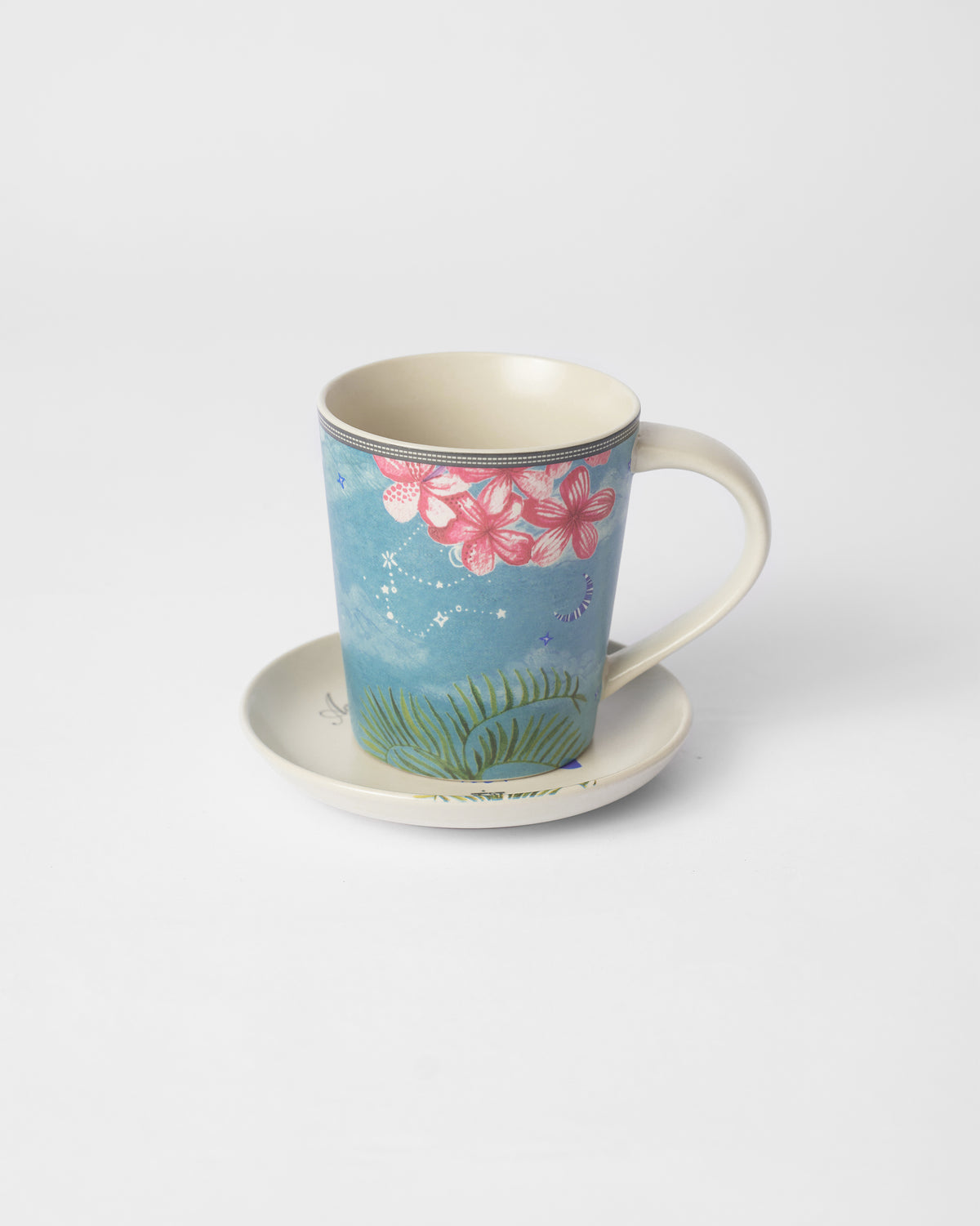 Nico Aquarius mug on its plate with pink flowers and stars.