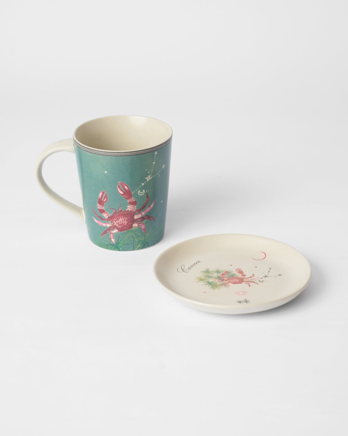 Nico Cancer mug and plate showing the red crab motif.