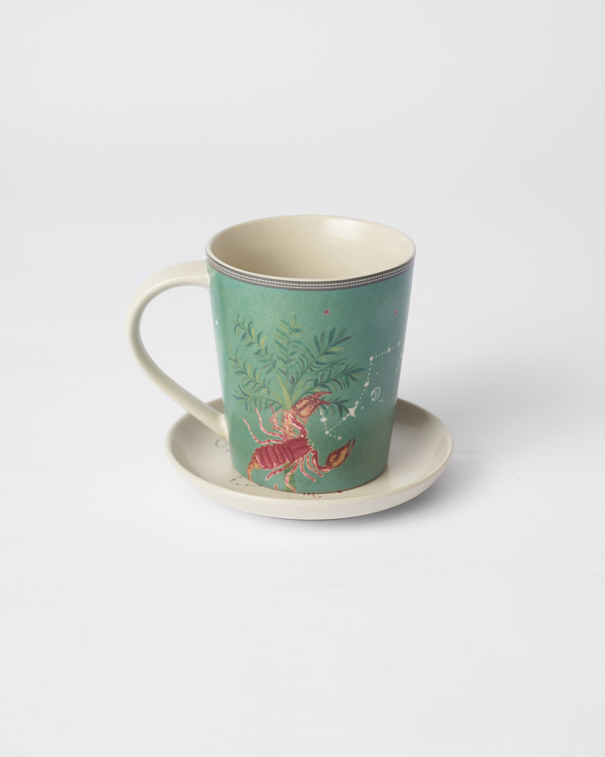 Nico Scorpio mug on its tea plate showing a scorpion under a palm.