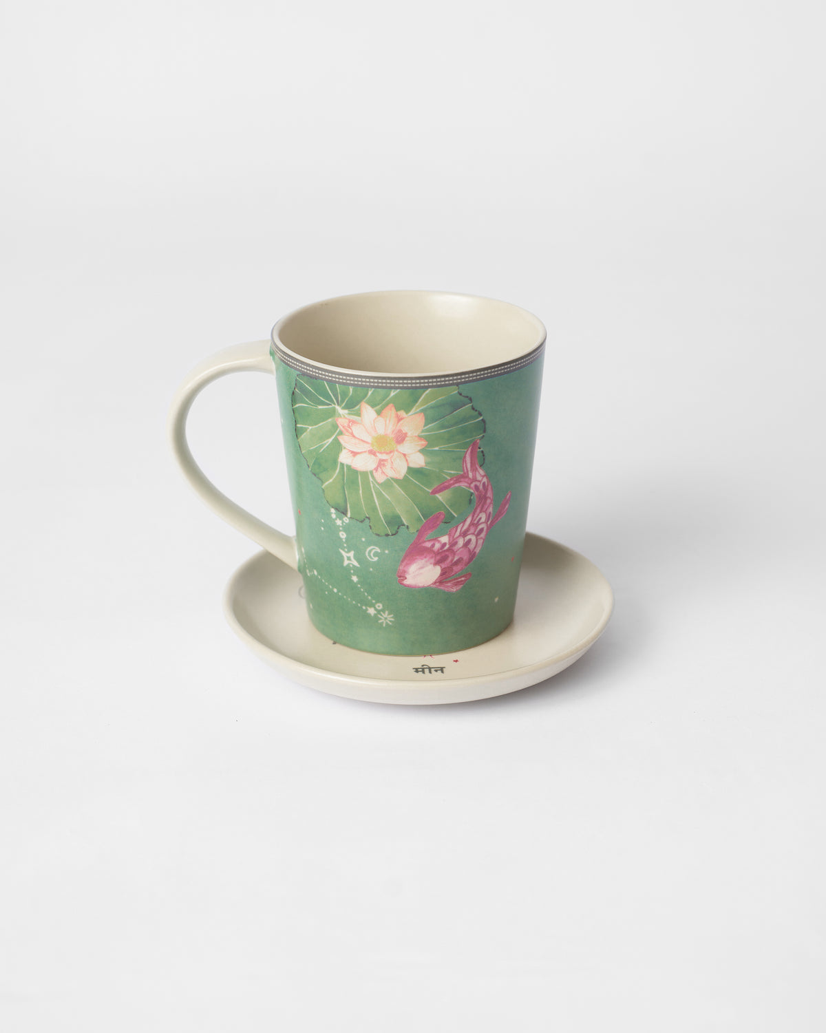 Nico Pisces Gift Set mug on its saucer, showing a pink fish motif.