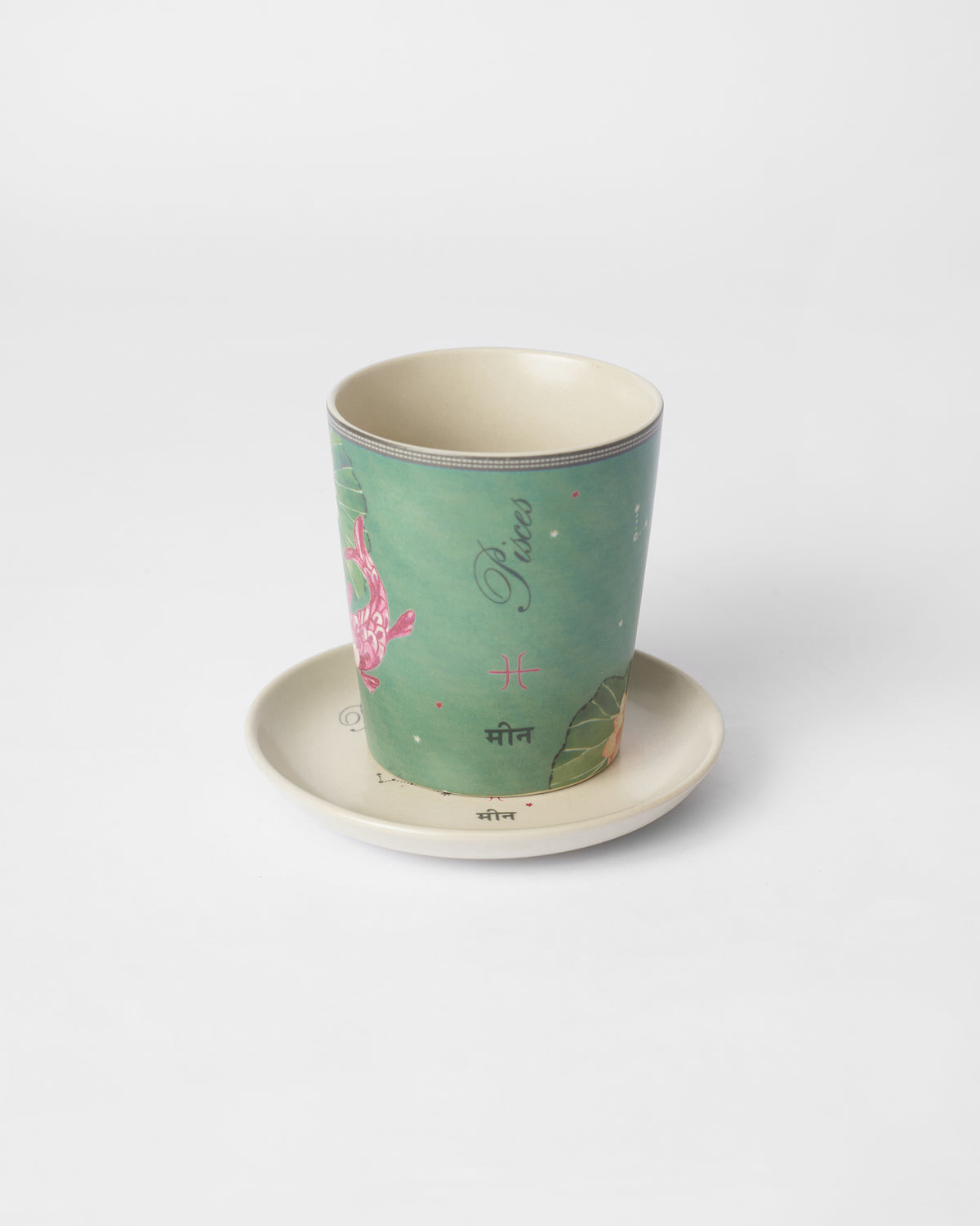 Nico Pisces Gift Set mug on its saucer, showing the Pisces lettering.