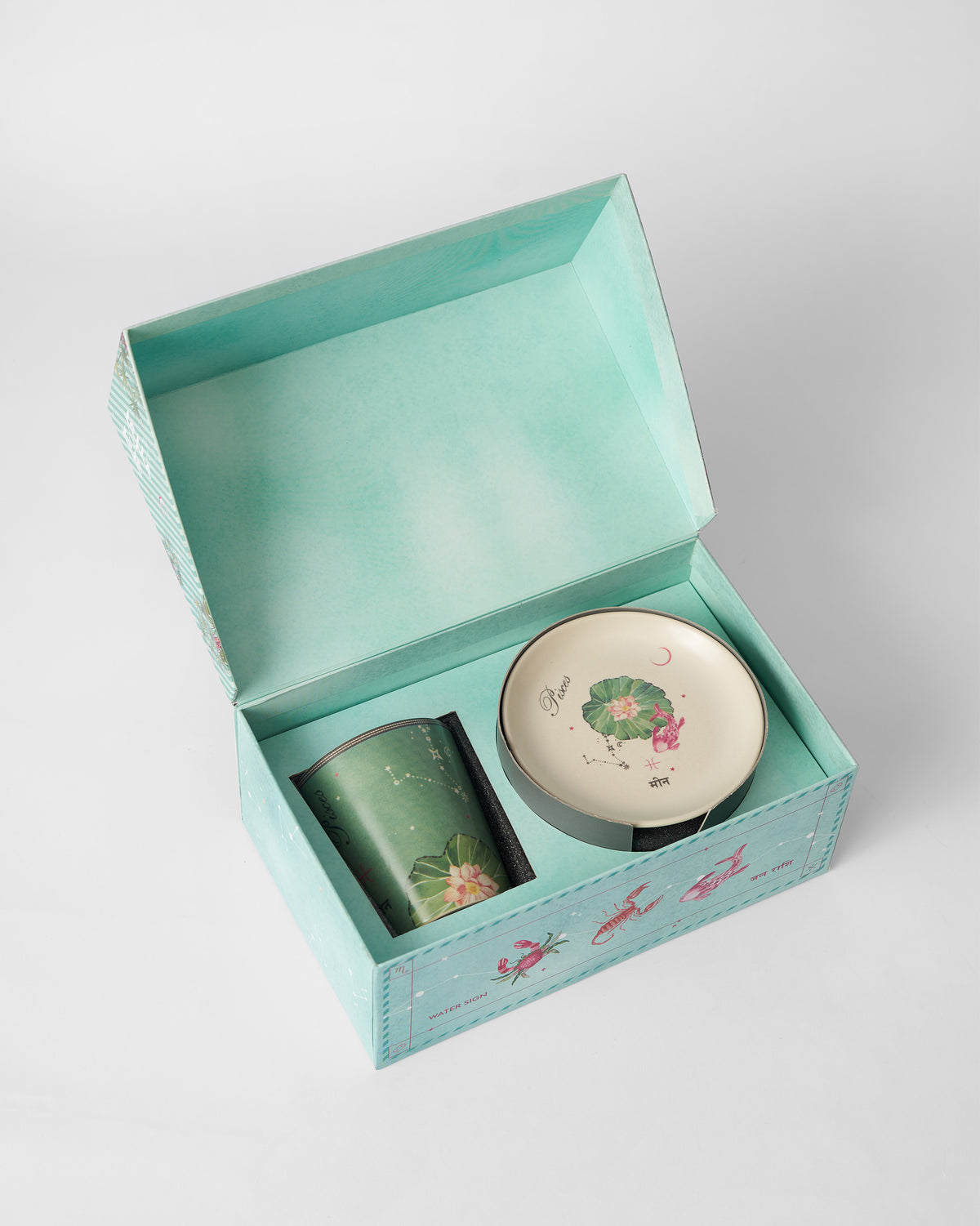Nico Pisces Gift Set in an open box with the mug and saucer inside.