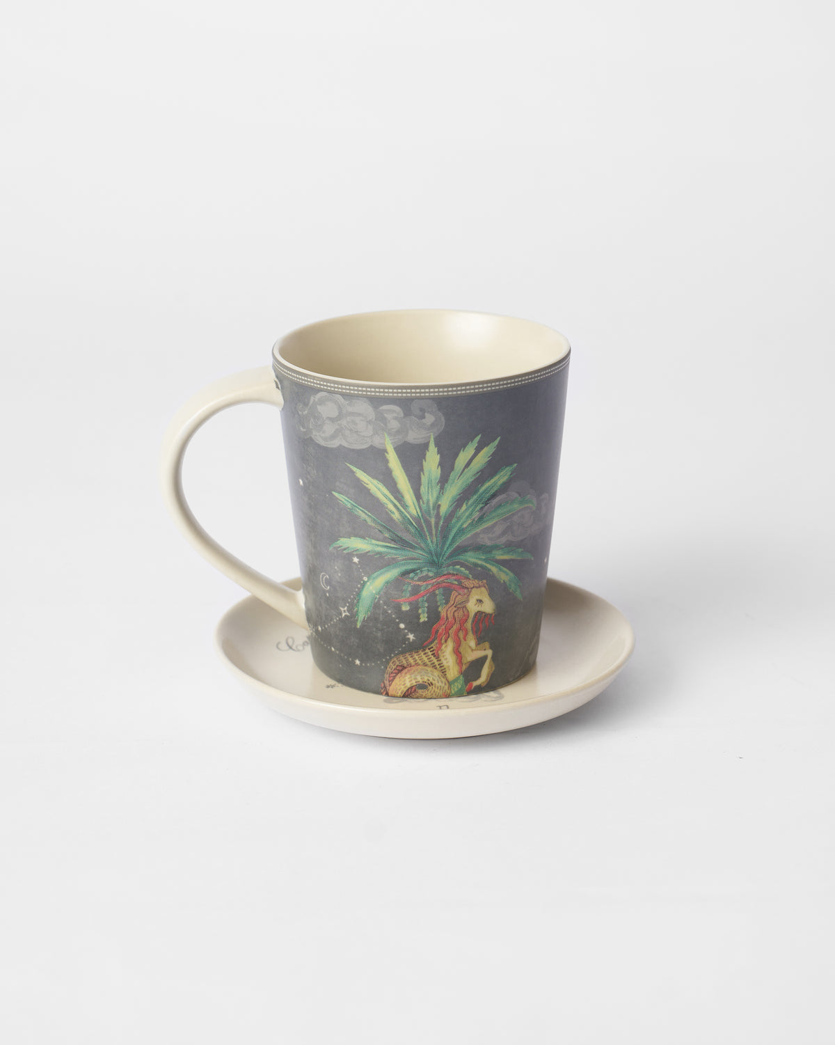 Nico Capricorn Gift Set mug on saucer with sea-goat under palm print.
