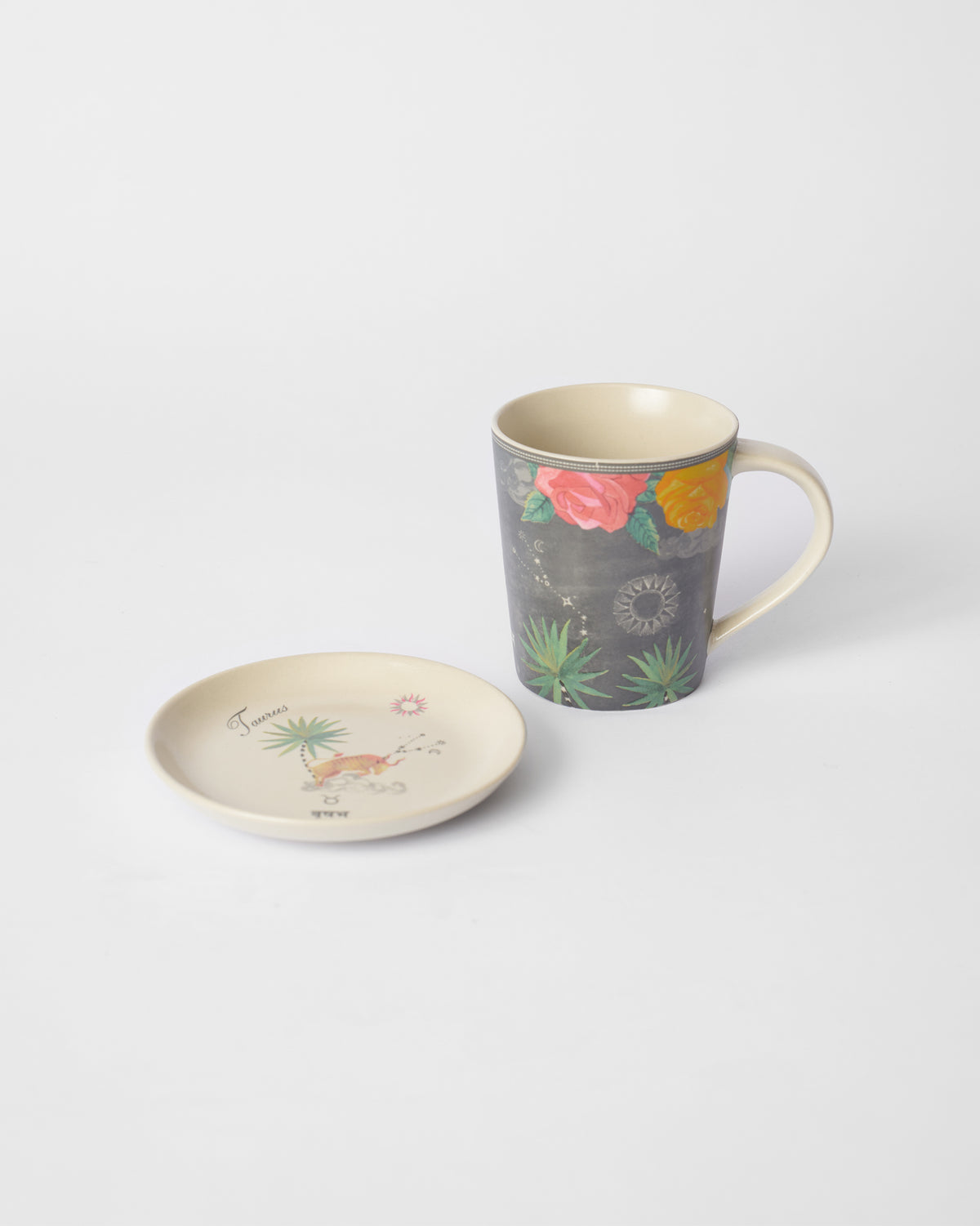 Nico Taurus mug with floral print beside a matching tea plate.