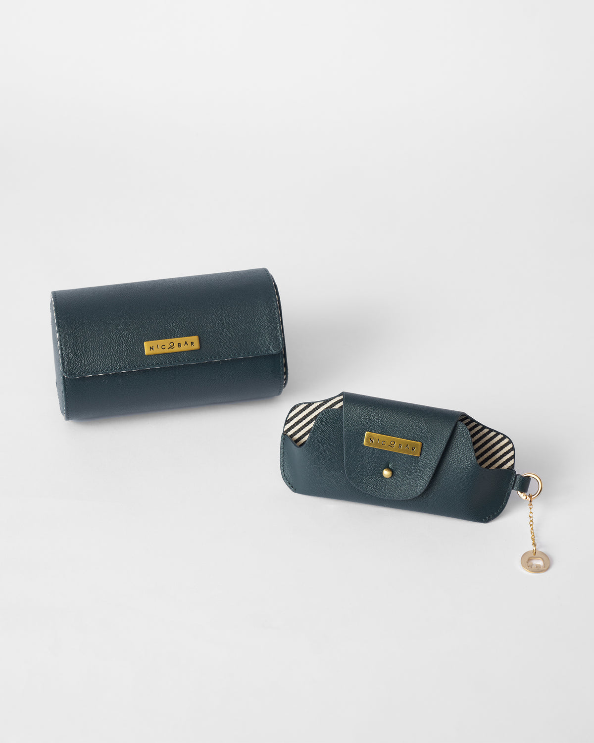 Tusker Gift Set leather roll case and pouch side by side, with a striped pouch lining.