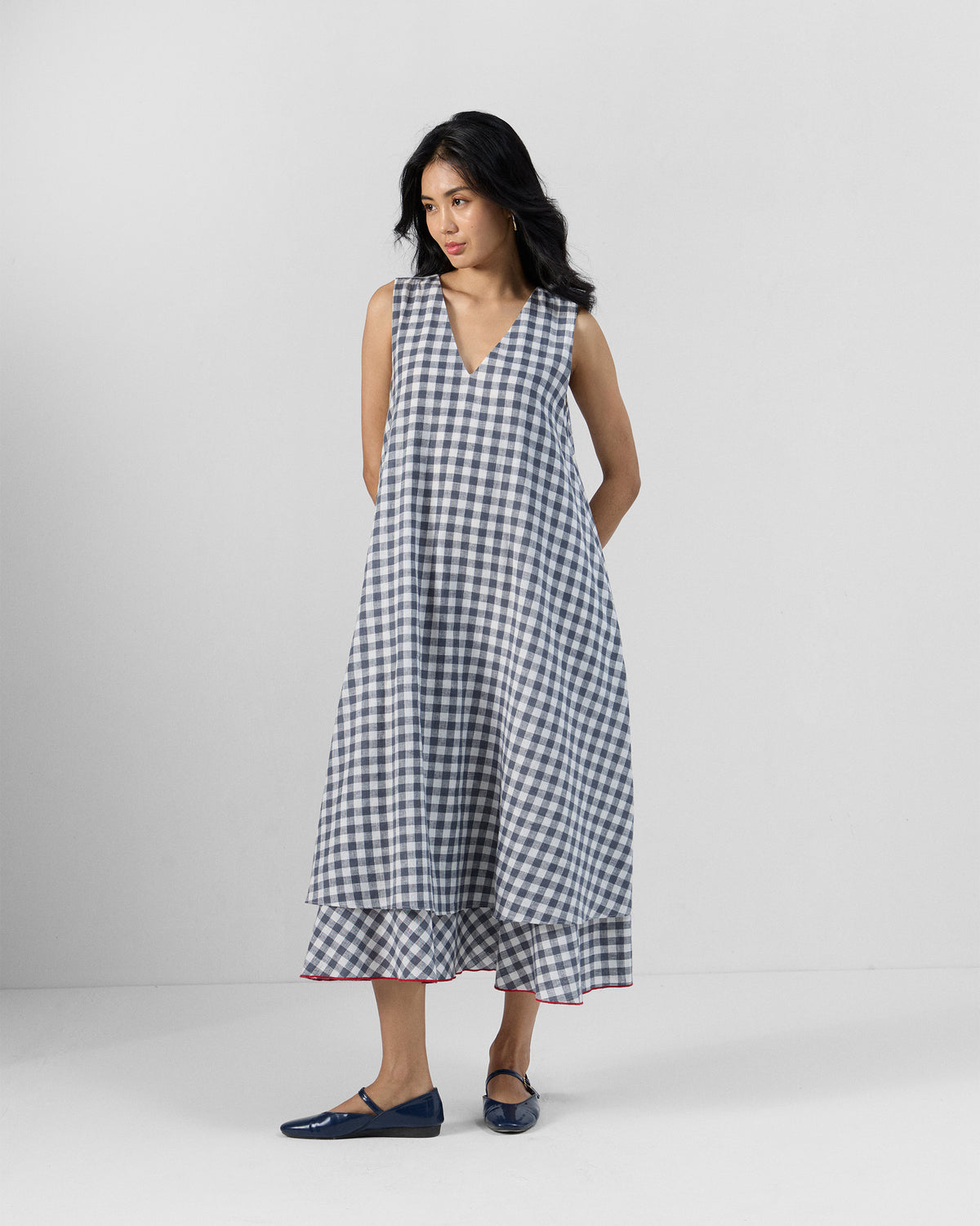 Grey and white check Ezra dress with a V-neck and bias-cut hem panel.