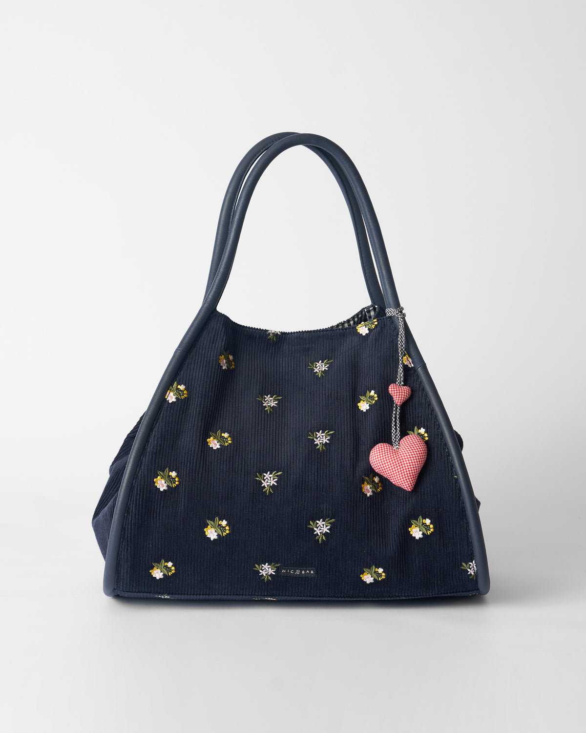 Navy corduroy Ditsy bag with floral embroidery and gingham heart charms.