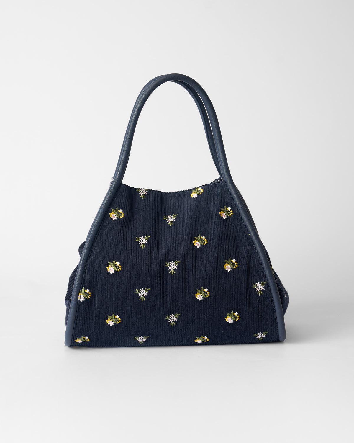 Navy corduroy Ditsy bag with scattered floral embroidery.