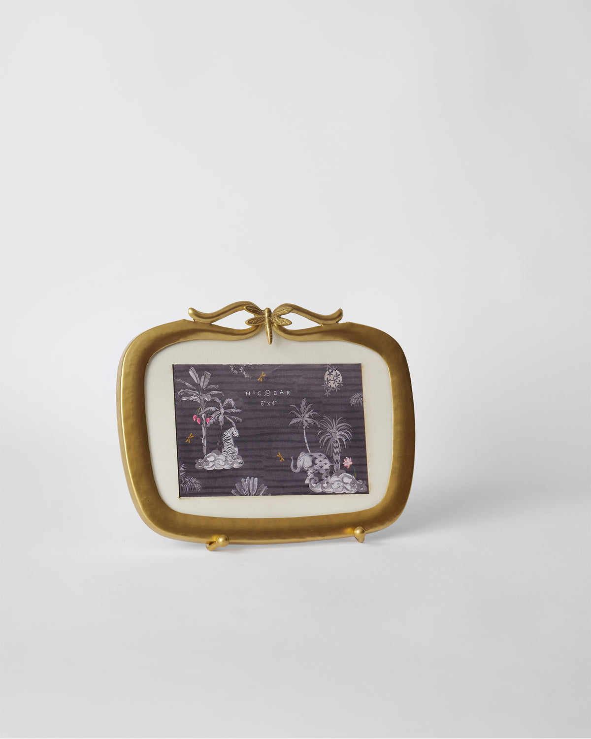 Matte gold Leap photo frame with a dragonfly crest on its stand.