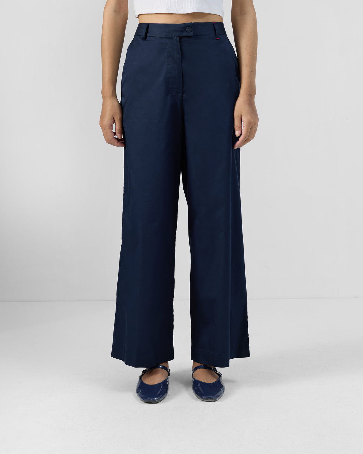 Navy Vita Pants with a high waist and wide straight legs.