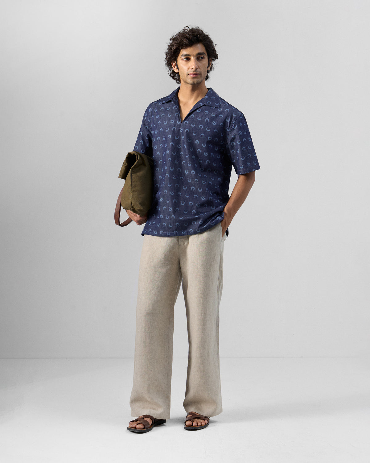 Person wearing an indigo moon-print Yamuna kurta shirt.