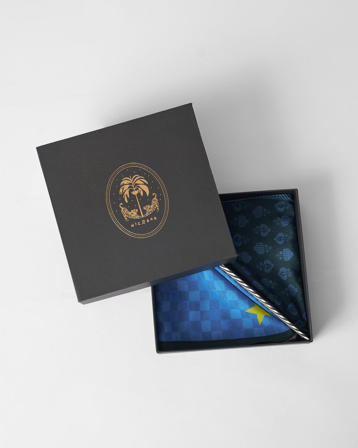 Twilight Pocket Square set folded in an open black Nicobar gift box.