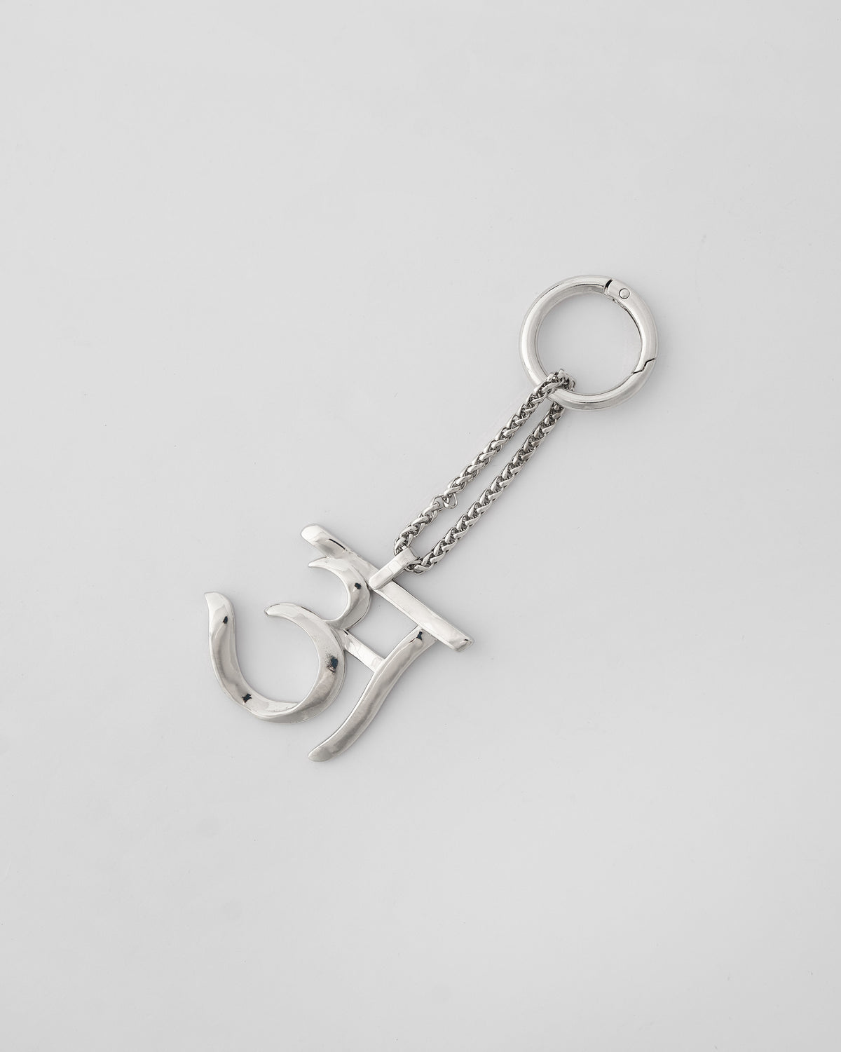 Alphabet A Bag Charm in silver, with chain and clasp ring on a light background.